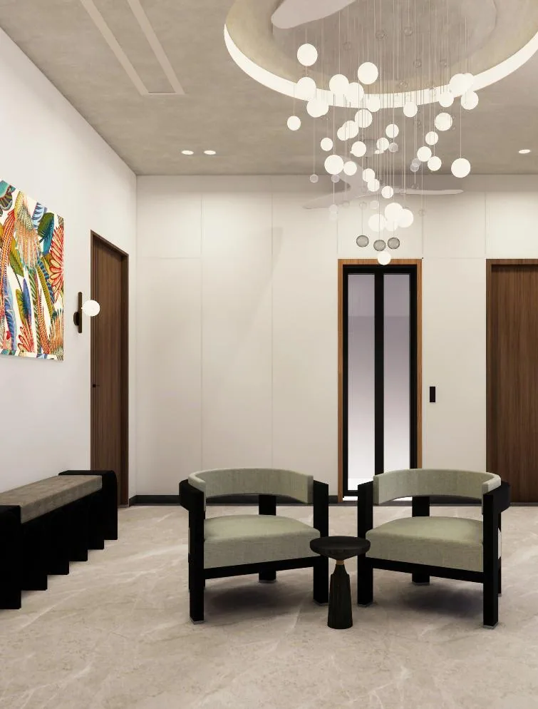 Upper lobby with two armchairs under a cluster of glass pendant lights